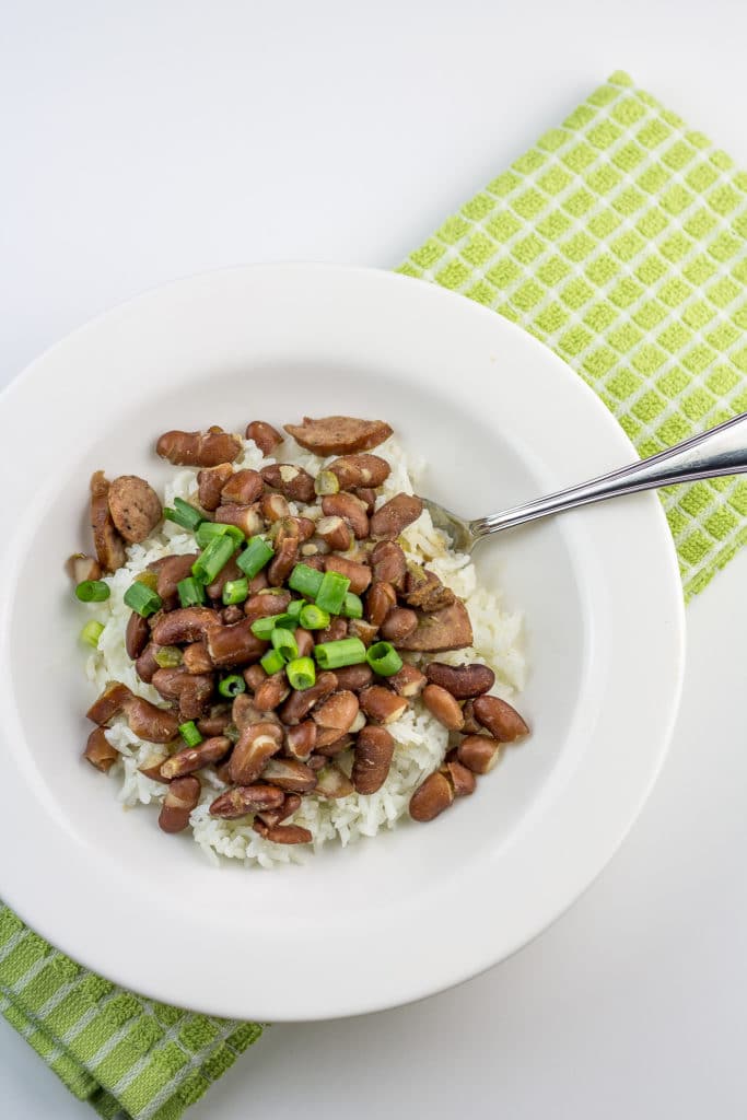 Delicious spicy red beans and rice with andouille sausage. This recipe's the perfect portion for two! It makes two big dinner-sized servings, plus two lunch-sized portions for leftovers.