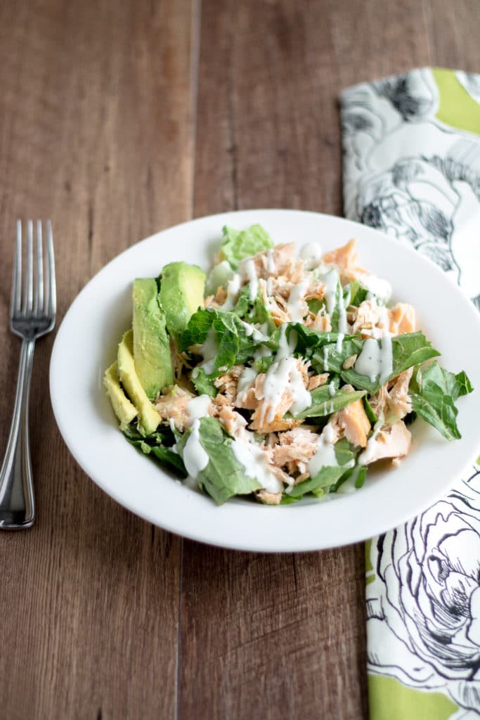 Grilled Salmon salad with avocado and ranch dressing. The perfect way to use up leftover grilled salmon!