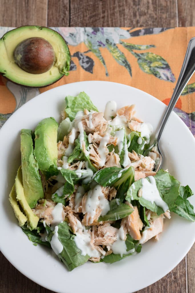 Grilled Salmon salad with avocado and ranch dressing. The perfect way to use up leftover grilled salmon!