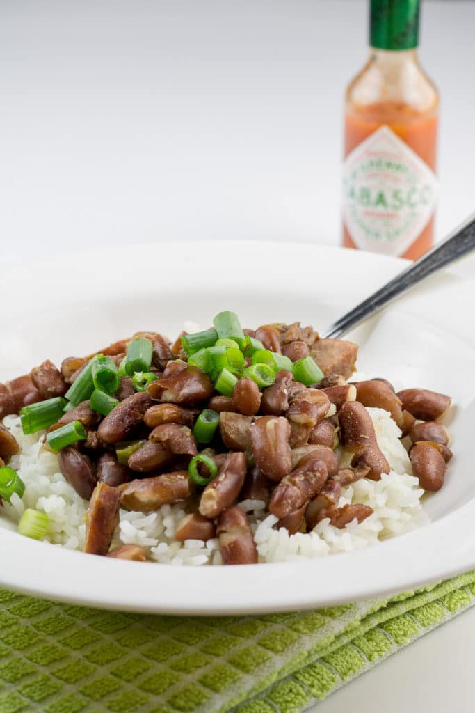 Delicious spicy red beans and rice with andouille sausage. This recipe's the perfect portion for two! It makes two big dinner-sized servings, plus two lunch-sized portions for leftovers.