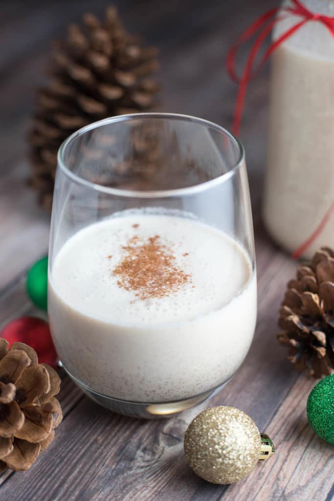 a glass of coquito on a table